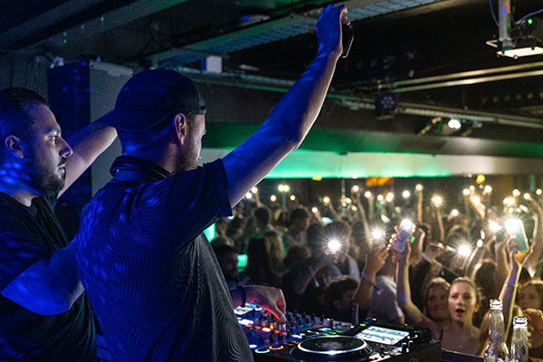 wide shot of students at a club night