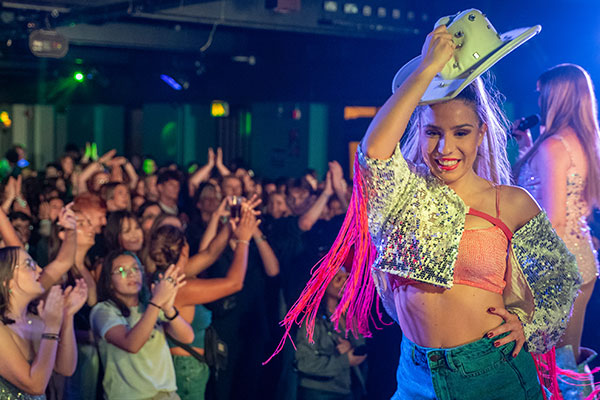 a dancer on stage during glitter ball