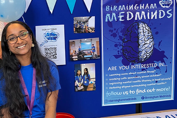 students at a stand at medsoc fair