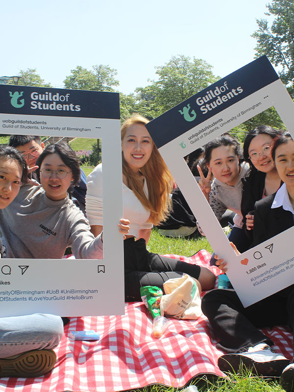 a picture of students holding up a guild instagram cutout