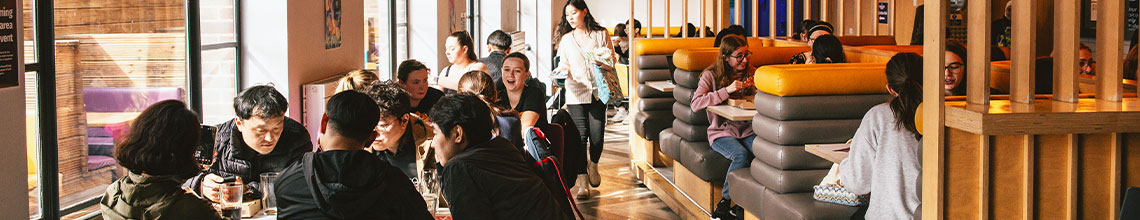 a picture of students at a dog cafe