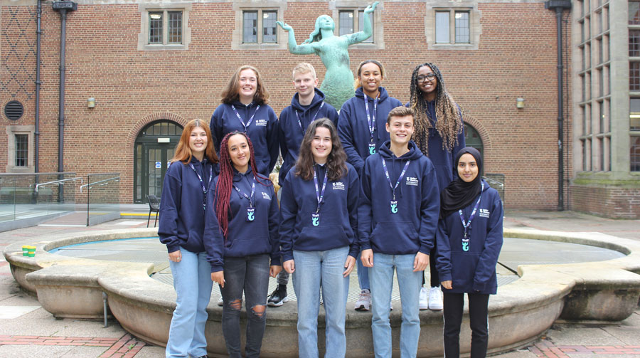 a picture of student staff wearing guild hoodies